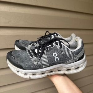 Black and gray On Cloud running shoes
